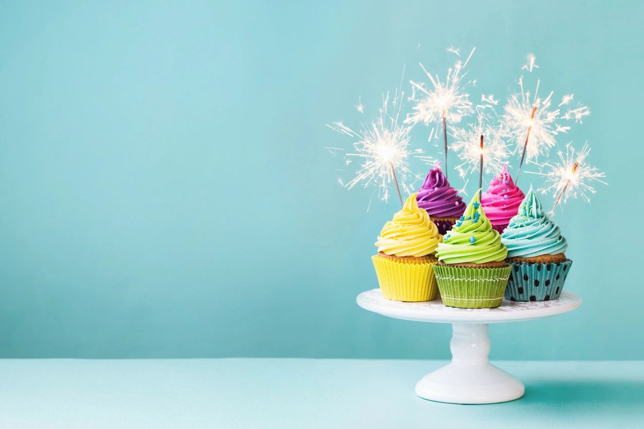 Birthday party celebration with cupcakes and sparklers